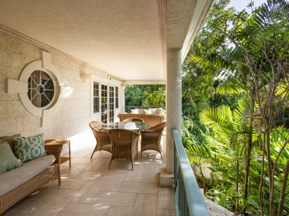 Expansive patio at Mon Caprice, Sandy Lane, offers stunning views and luxurious outdoor living space in Barbados, perfect for relaxation.