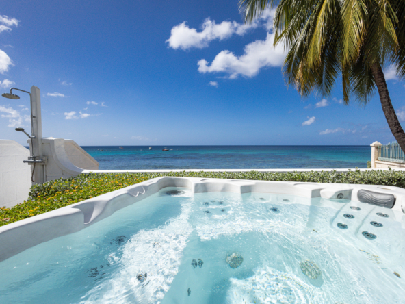 Barbados luxury beachfront villa view from jacuzzi in the garden with Caribbean Sea view beyond