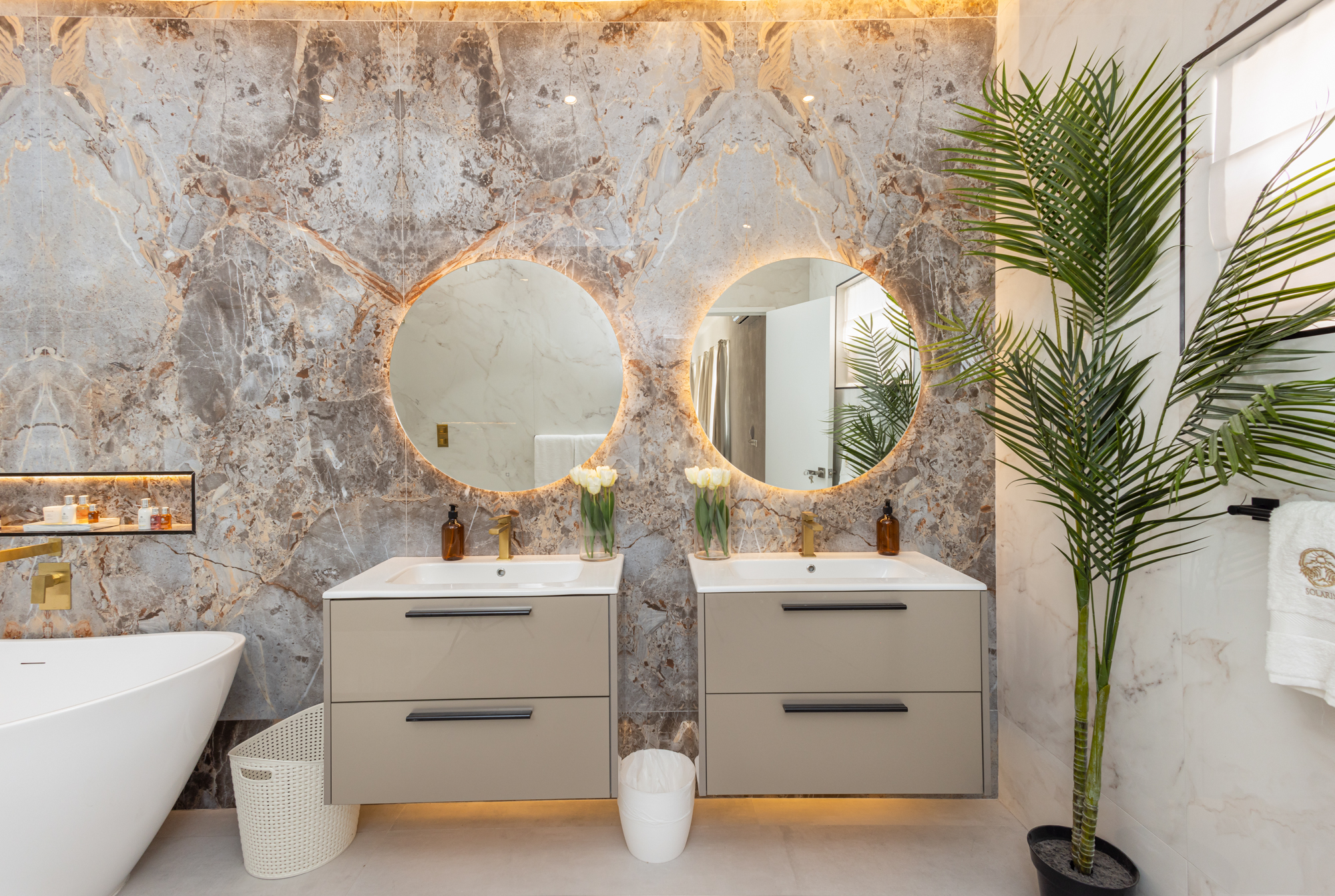Barbados luxury modern beachfront villa master suite luxury bathroom with two sinks, shower and bath