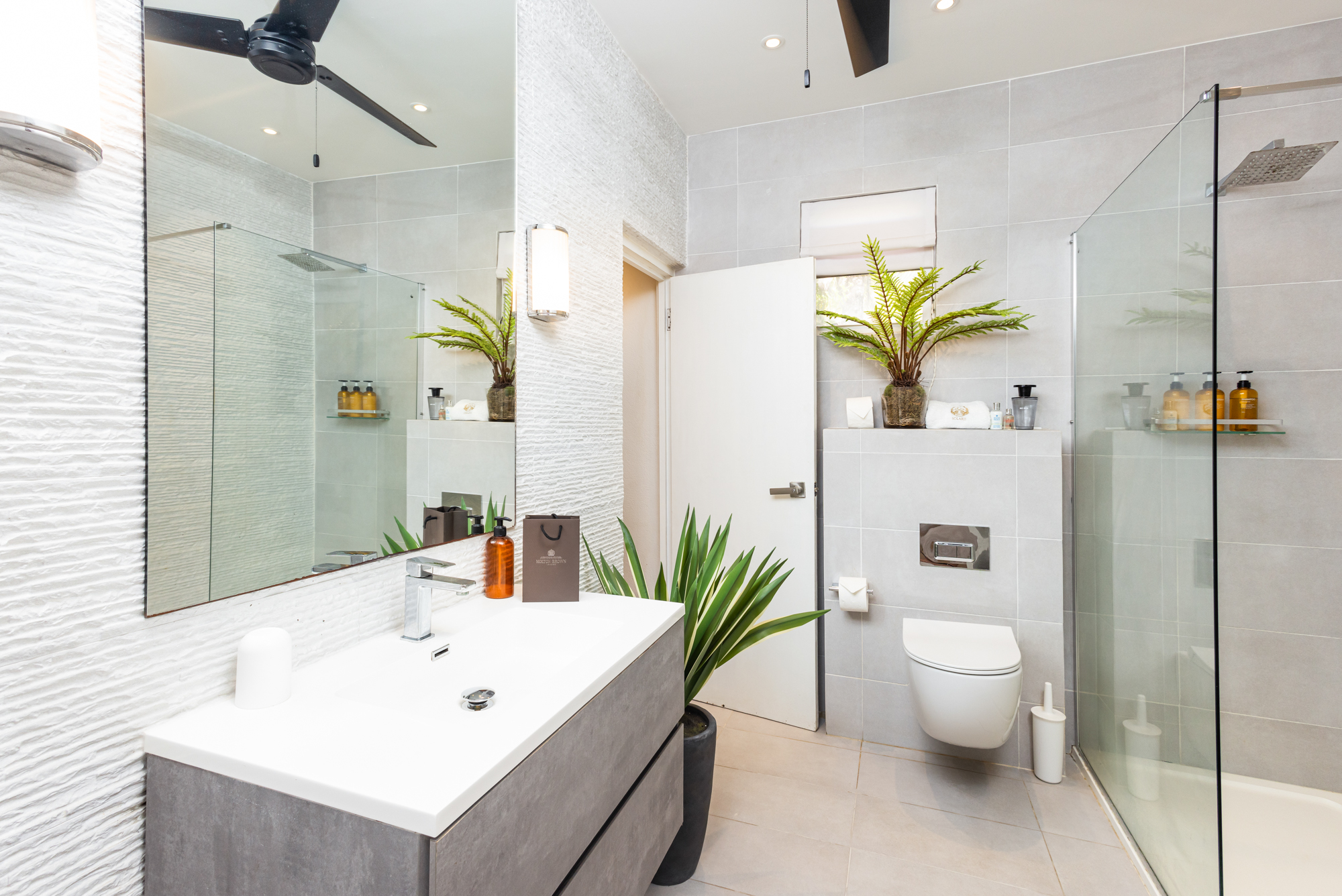 Barbados luxury modern beachfront villa guest suite bathroom
