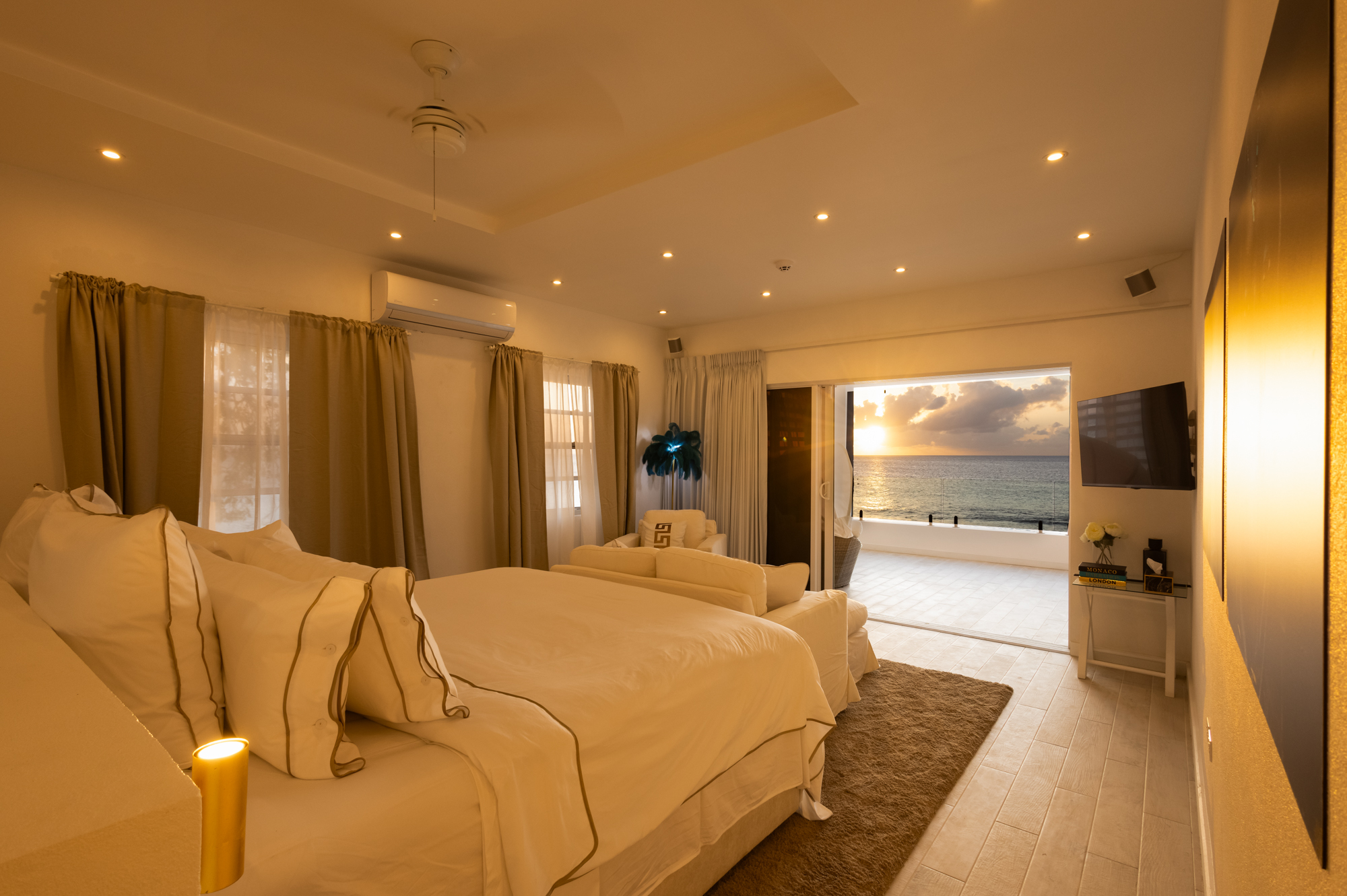 Barbados luxury modern beachfront villa master suite with Caribbean Sea sunset views