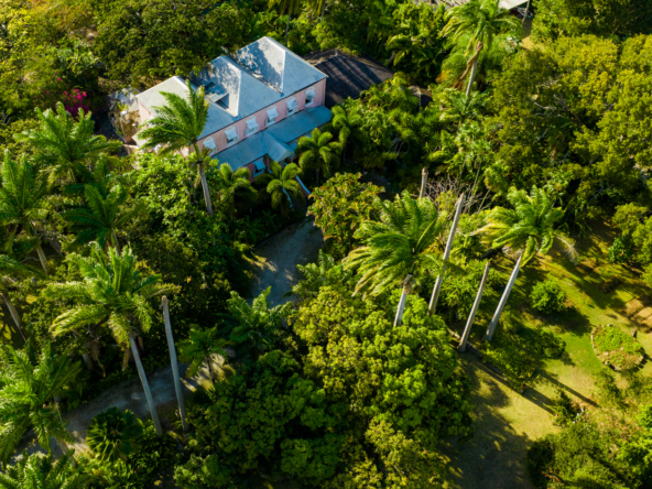 Lancaster Great House aerial view presenting Plantation House surrounded by green lush tropical gardens