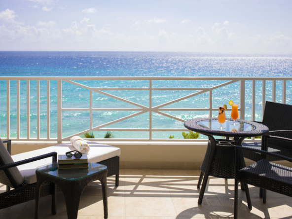 Expansive balcony at Apartment No. 509, O2 Beach Club & Spa, offering panoramic views of the Caribbean Sea and luxury outdoor living in Barbados.
