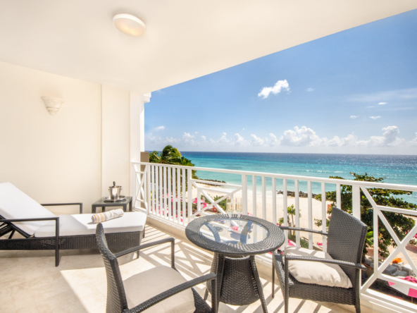 Expansive balcony at Apartment No. 505, O2 Beach Club & Spa, offering panoramic views of the Caribbean Sea and luxury outdoor living in Barbados.