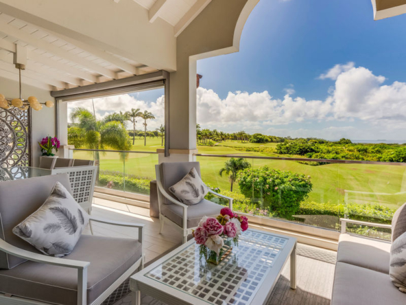 Golf course views from patio of modern townhouse Sugar Cane Mews for sale at Royal Westmoreland