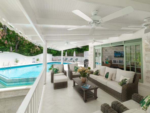 The deck and pool at Mustard Seed, a unique Barbados coral stone rental villa near Mullins Beach, offering luxury, comfort, and tropical serenity.