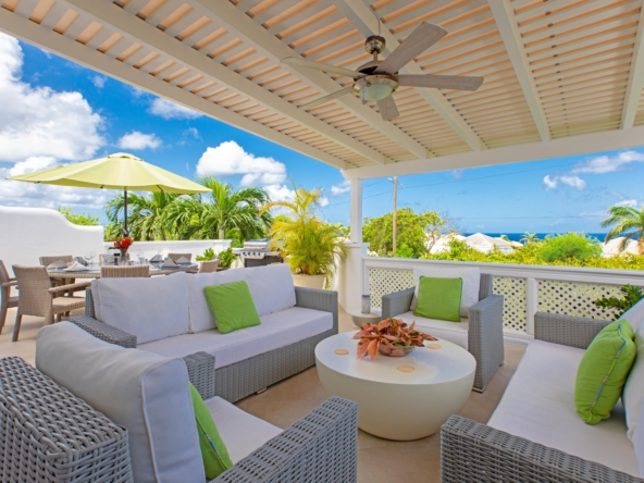 Balcony with chairs and blue sky at three-bedroom villa in Barbados