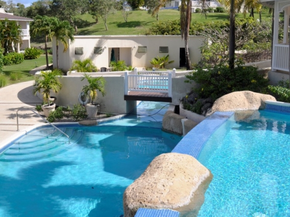 Discover a charming furnished apartment in Barbados at Vuemont No. 237, featuring two bedrooms, two bathrooms, and lush tropical surroundings.