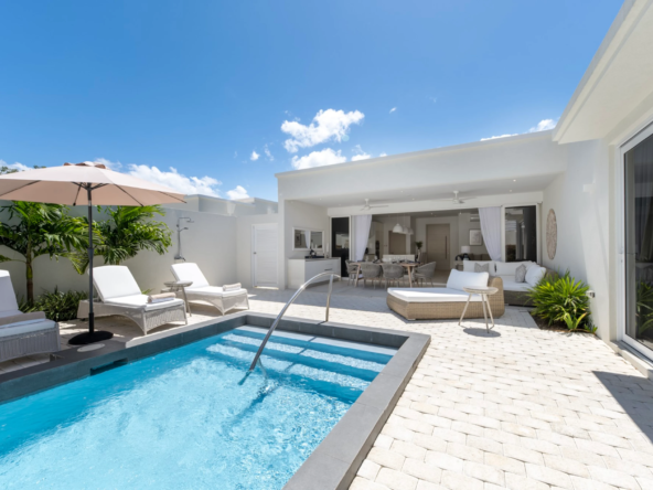 Pool and exterior of modern open-plan rental villa in Barbados, Porters Place 15.