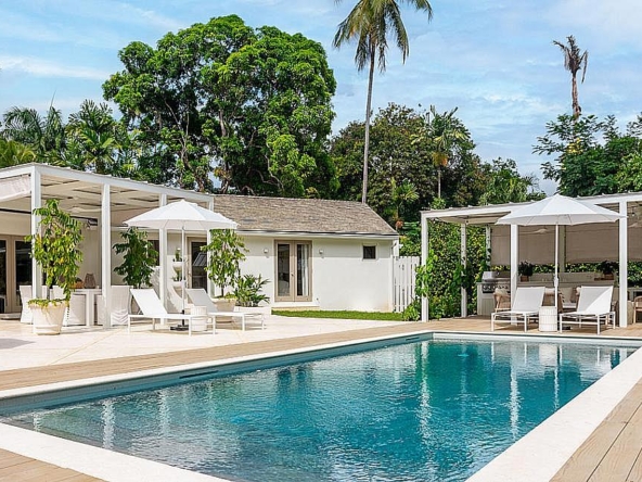 Pool and exterior of a modern vacation property in Holetown, Barbados.