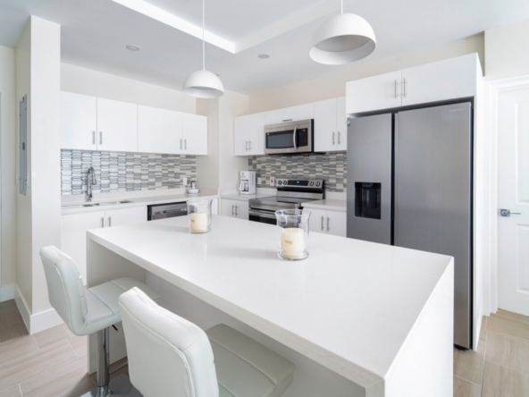 modern white kitchen in 2 bedroom vacation rental Coral Beach 107