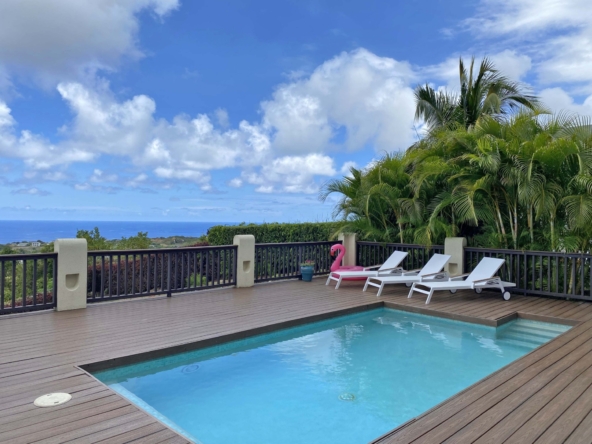 Pool, pool deck and blue sky view at Barbados island rental, Caribbean Dream