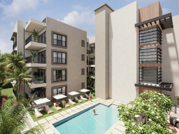 Exterior view of the condos, swimming pool, and blue sky at exclusive luxury condos, Westbeach.