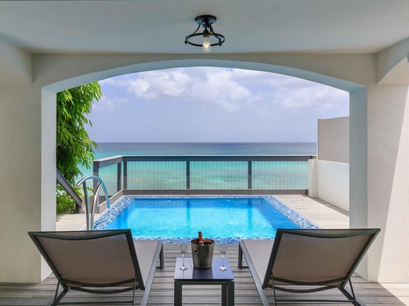 An image showing the beauitful exterior of the pool and blue skies at Modern Oceanfront Villa-prospect