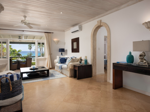 Elegant 2 bedroom ocean view Apartment for sale in Barbados' Beacon Hill, steps from Mullins Beach with rooftop pool and tropical gardens.